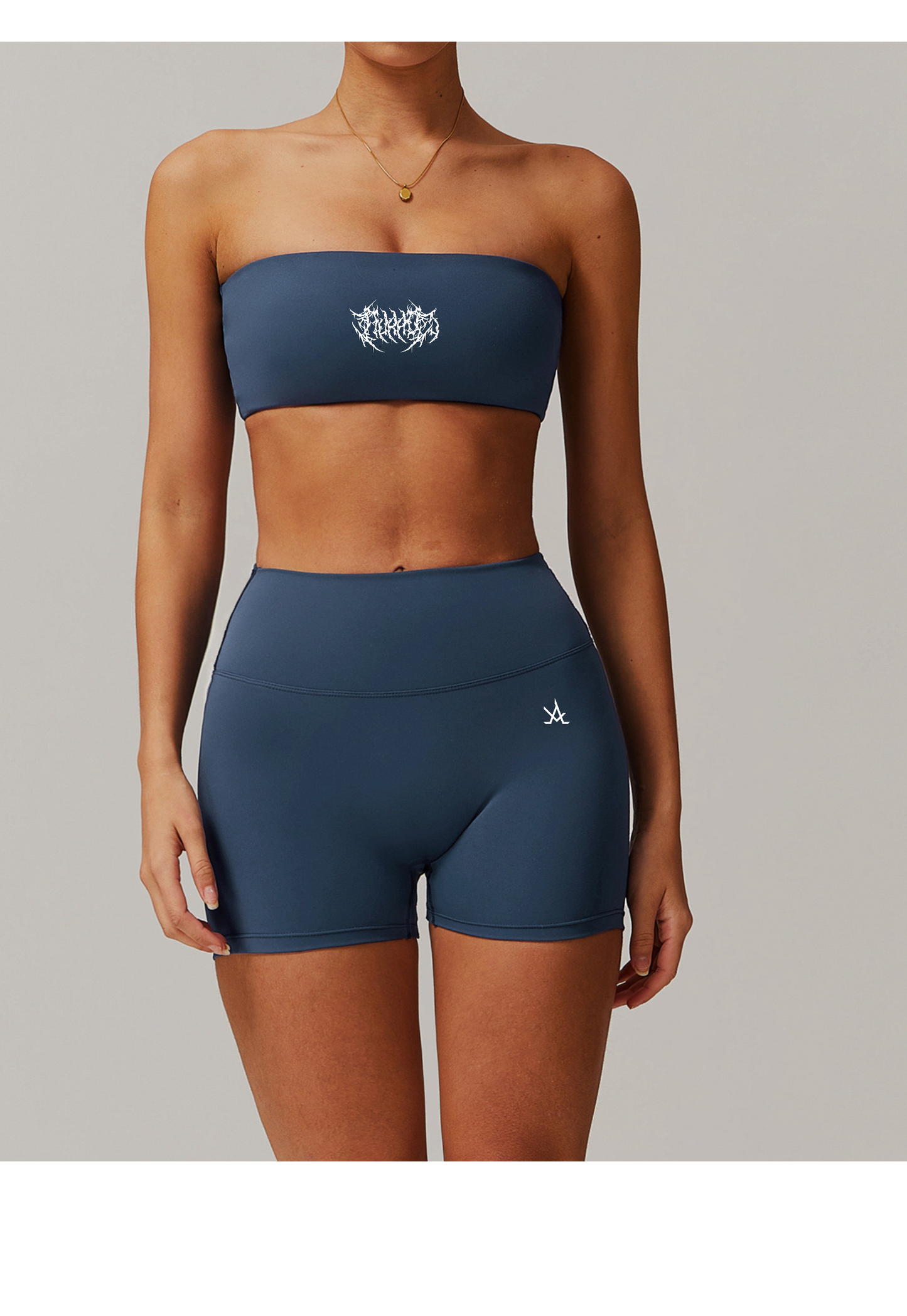 Aura Strapless Bandeau Bra in blue worn with matching high-waist shorts for gym and streetwear