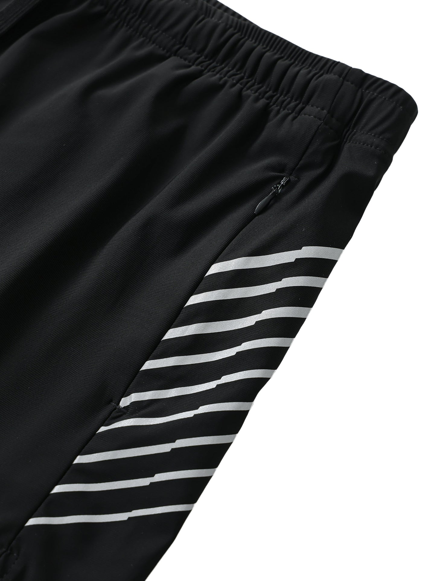 Close-up of men's side-stripe performance shorts with black fabric and white stripes, elastic waistband, and zipped pocket.