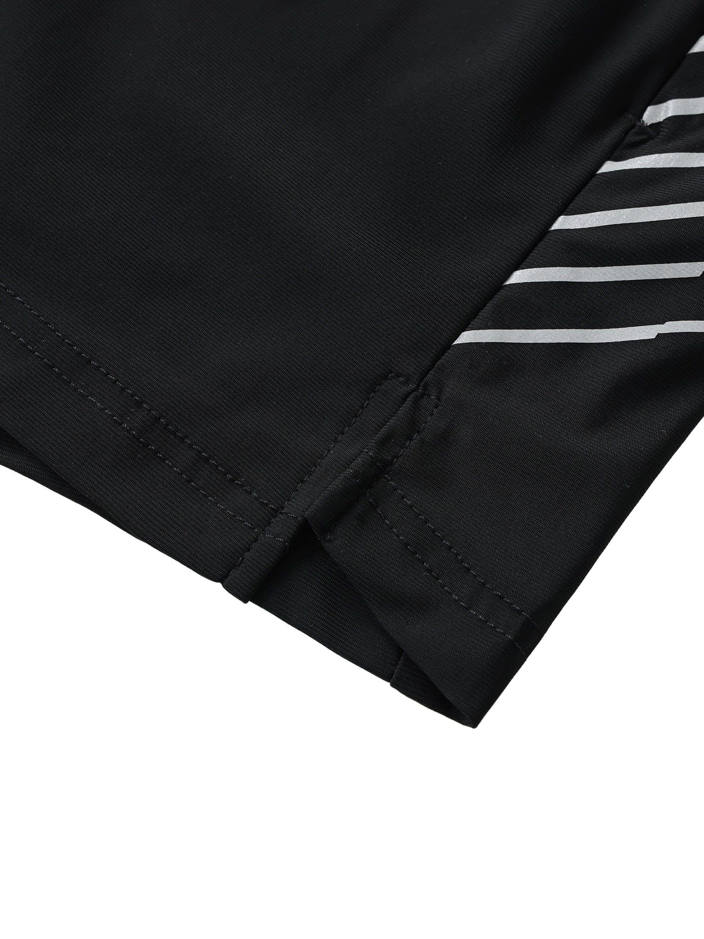 Close-up of men's side-stripe performance shorts hem with black fabric and white stripes