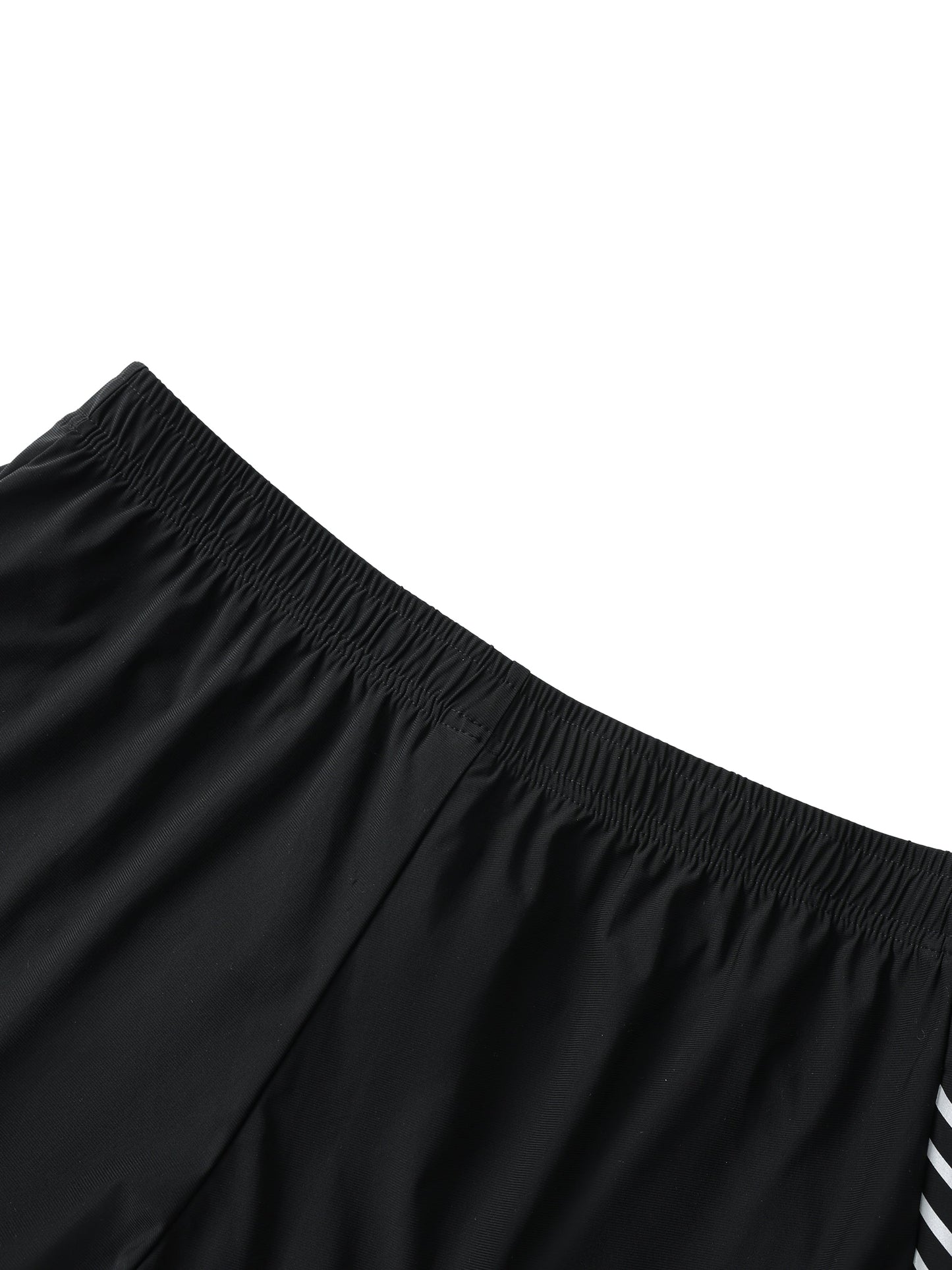 Men's side-stripe performance shorts in black nylon-spandex blend with elastic waistband