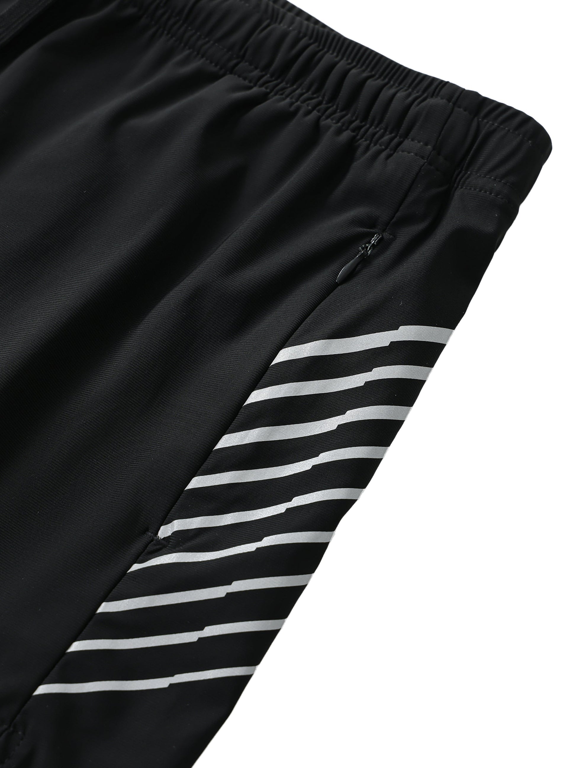 Close-up of men's side-stripe performance shorts with black fabric and white stripes, elastic waistband, and zipped pocket.