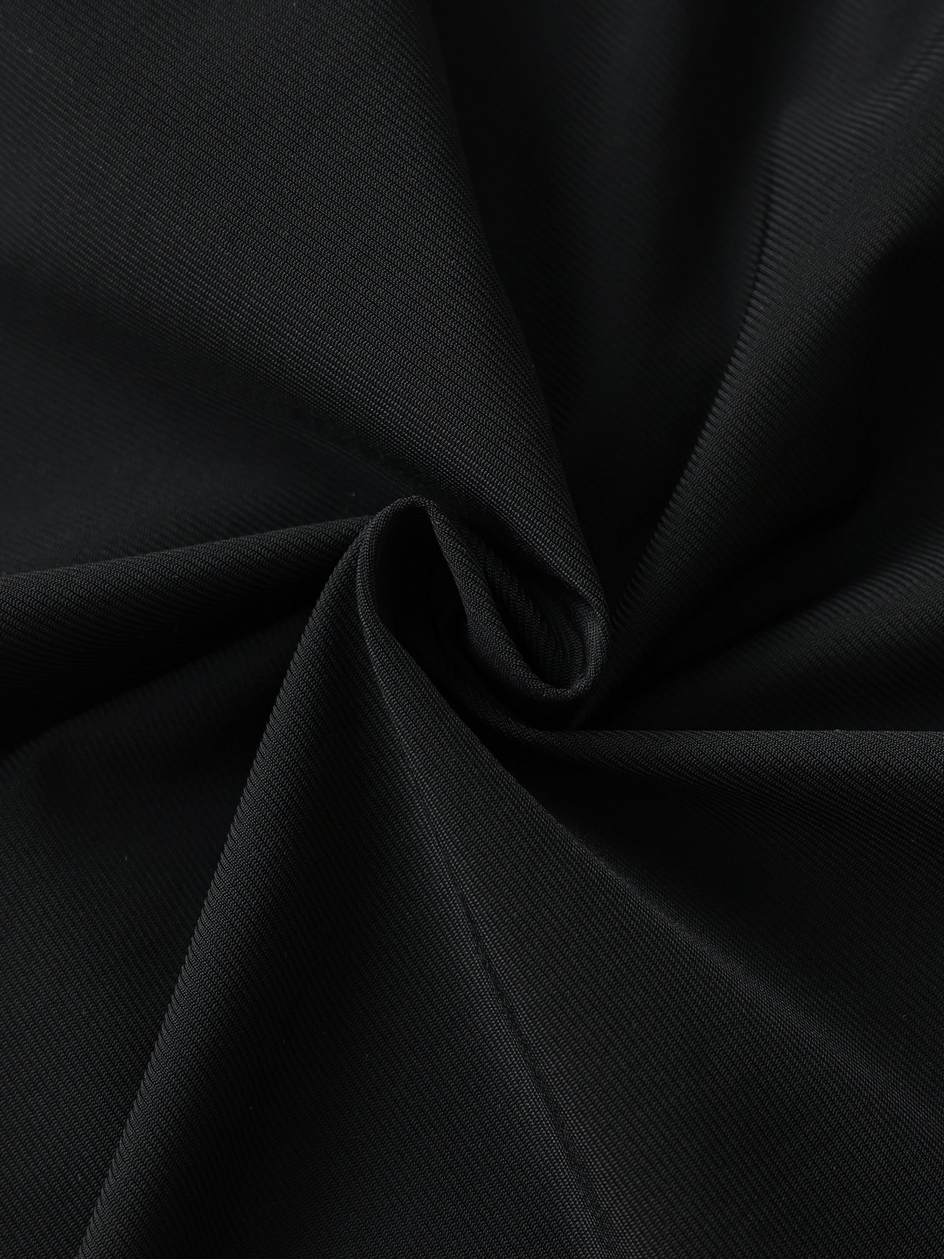 Close-up of black men's side-stripe performance shorts fabric made of nylon and spandex blend